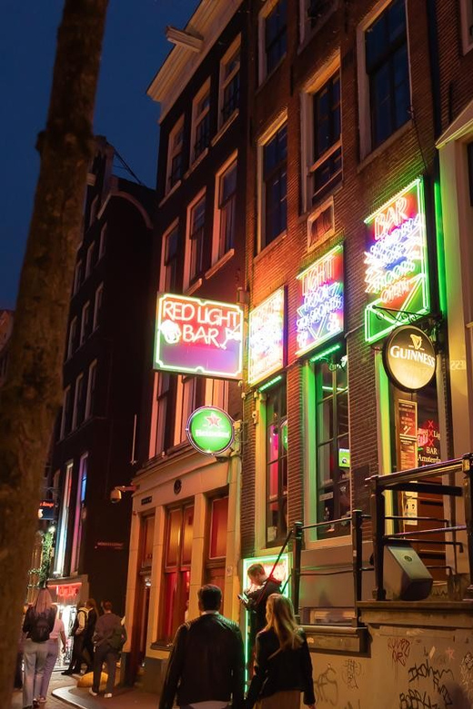 Amsterdam: Red Light Tour Exclusive + Peep Show - 1.5 Hours From Dam Square to Nieuwmarkt, Without Feeling Rushed