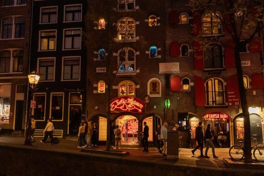 Amsterdam: Red Light Tour Exclusive + Peep Show - Condomerie and the Warmoesstraat Zone: History Meets Street-Level Reality