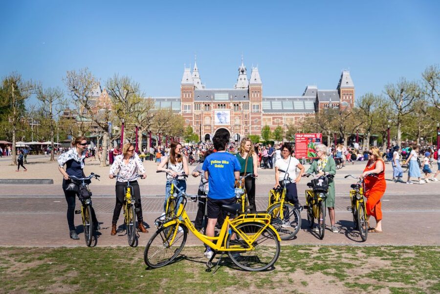 Amsterdam: Relaxed City Highlights Guided Bike Tour - Getting Started at Nieuwezijds Kolk, the Mokum Launch Point