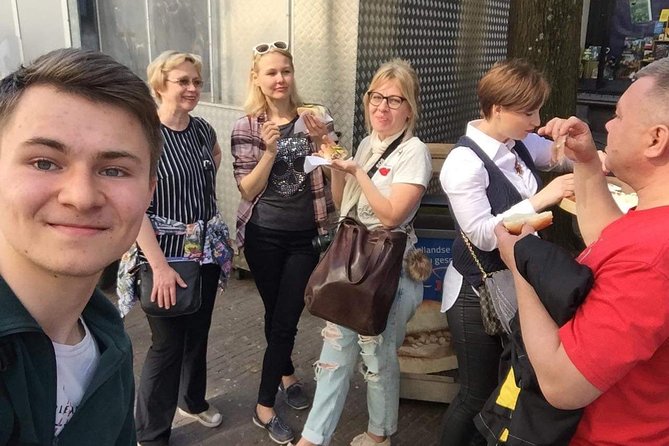 Amsterdam Sightseeing Tour + Hidden Gems + Tastings + PDF guide - Tuschinski Theatre and Bloemenmarkt, where architecture and commerce meet