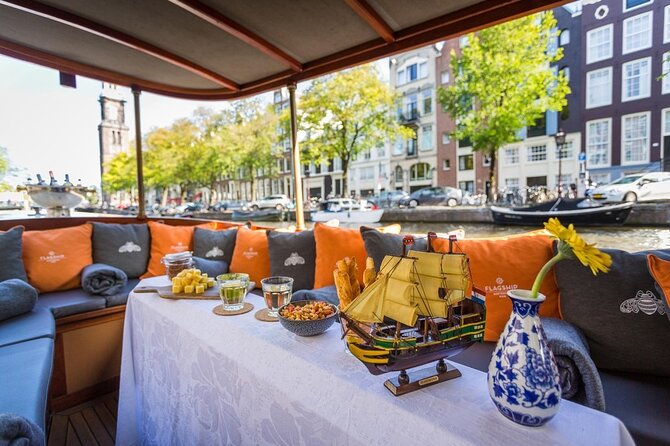 Amsterdam Small-Group Bike Tour With Canal Cruise, Drinks, Cheese - Prins Hendrik Bust and the Shift to the Canal Cruise