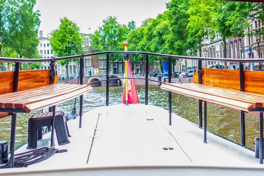 Amsterdam: Small-Group Canal Cruise incl. Drinks and Snacks - Amstel River and Magere Brug: where the city looks cinematic