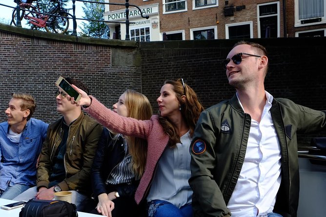 Amsterdam Small-Group Canal Cruise Including Snacks and Drinks - Getting on at Keizersgracht, then cruising the city in about two hours
