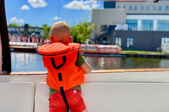 Amsterdam Small-Group Canal Cruise Including Snacks and Drinks - Maritime and botanic touches: National Maritime Museum, Golden Age ships, Hortus Botanicus