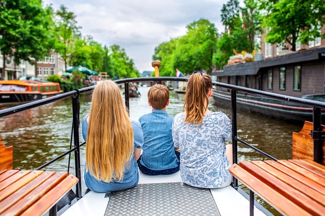 Amsterdam Small-Group Canal Cruise With Dutch Snacks and Drink - Westerkerk and the canal approach to Amsterdam’s big landmarks