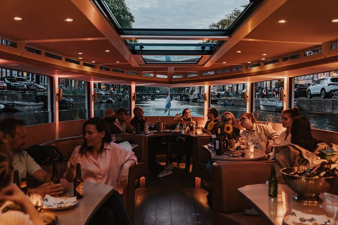 Amsterdam Small-Group Evening Canal Cruise Including Wine, Craft Beer, Cheese - The appeal: a calm 90 minutes of Amsterdam by night
