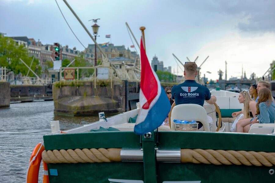 Amsterdam: The Newest Canal Cruise with Drink Option - Skipper stories, language options, and how to hear them
