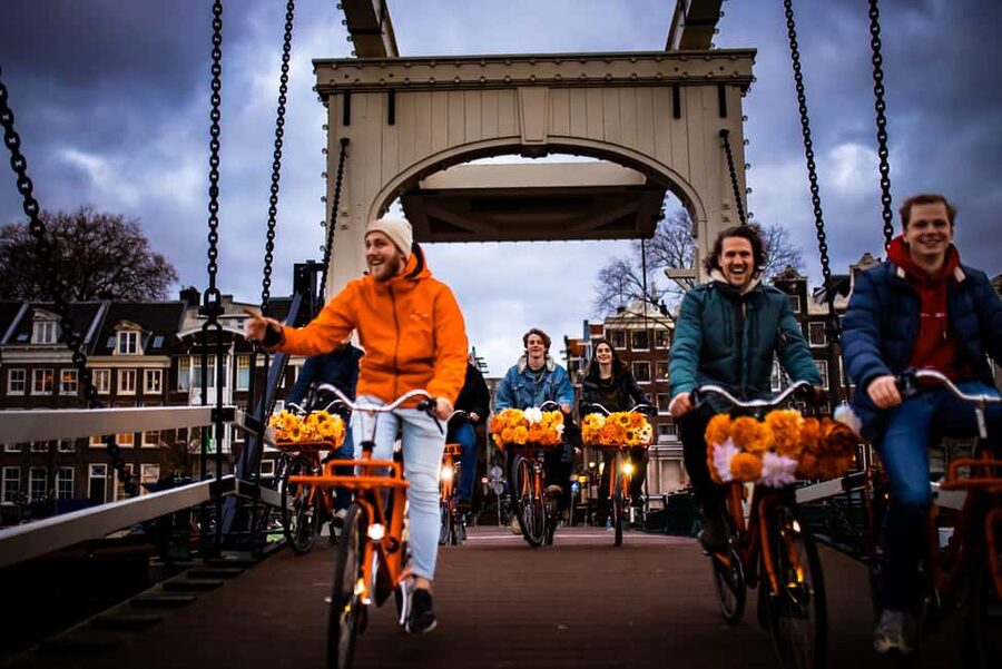 Amsterdam: Top Highlights Guided Bike Tour - De Negen Straatjes and the Flower Market Pass: Texture, Not a Full Stop