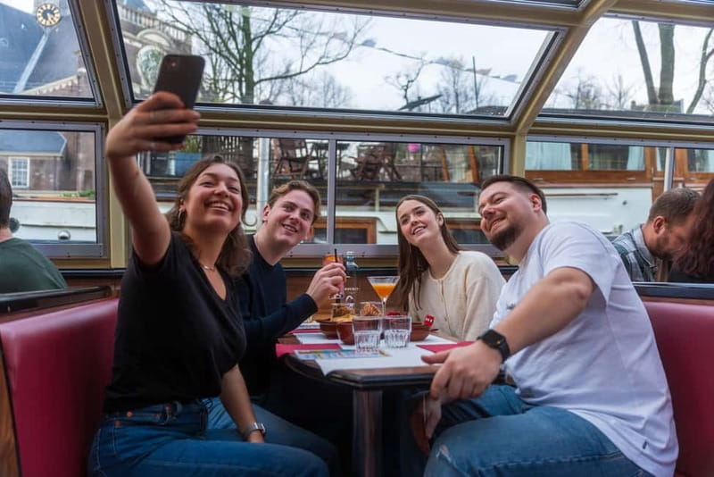 Amsterdam: Unlimited Cocktails Cruise on the Canals - Warm and Cozy Boat Setup, Plus Where to Sit for Photos