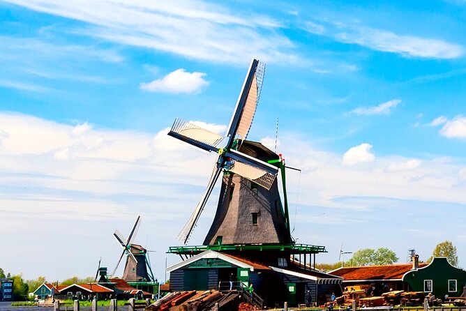 Amsterdam: Windmills, Cheese and Volendam Tour with Video Guide - Amsterdam to Zaanse Schans: Windmills That Still Do Work