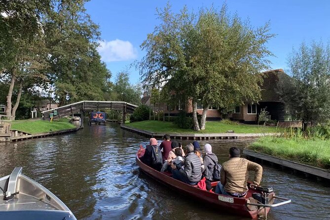 Day Tour Giethoorn, Afsluitdijk and Zaanse Schans with Boat Cruise - Zaanse Schans: Cheese, Wooden Shoes, and a Diamond Demo in Windmill Country