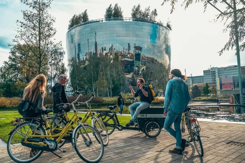 Discover Rotterdam: Classic Highlights Bike Tour by a Local - Hotel New York and Erasmus Bridge: the city opens fast