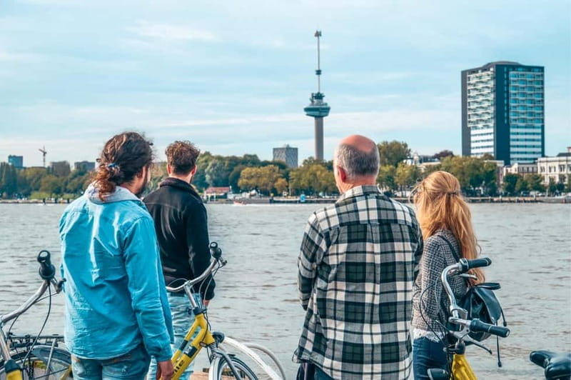 Discover Rotterdam: Classic Highlights Bike Tour by a Local - Stadhuis Rotterdam and Grote of Sint-Laurenskerk: traditional landmarks, city-scale context
