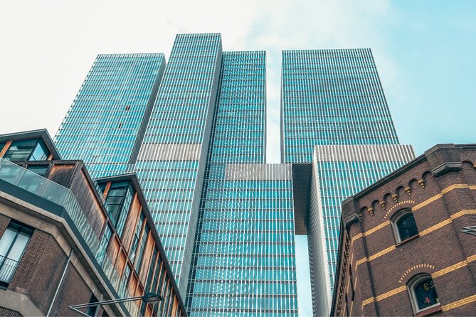 Discover Rotterdam: Classic Highlights Bike Tour with a Local - Hotel New York, the Fenix Museum view, and a strong start