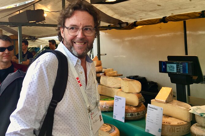 Exclusive Cheese Walk & Dutch Wine Discovery - Negen Straatjes: two cheese shops, canal bridges, and buying smarter
