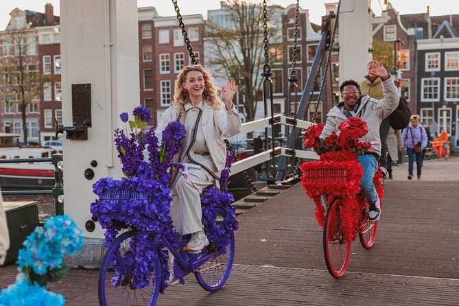 Explore Amsterdam canals on iconic Flower Bikes - Jordaan by bike: narrow streets, boutique energy, canal-side charm