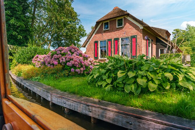 Giethoorn Day Trip from Amsterdam with Boat Trip - The “extra stops” question, especially the dyke talk