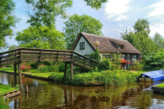 Giethoorn Private Tour, Canal Cruise and Windmills from Amsterdam - Zaanse Schans windmills: photos, inside access, and the paint mill story