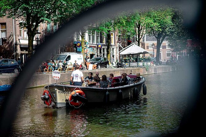 Guided Amsterdam Canal Cruise – Snacks & Drinks on board(1 Hour) - Your guide and the small-group feel: why it feels personal