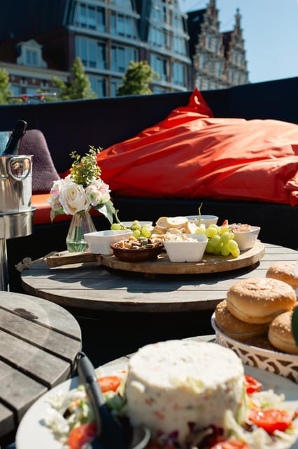 Haarlem: Sightseeing Boat Tour with Snacks and Drinks - The boat ride itself: a 1954 antique sloop with covered comfort