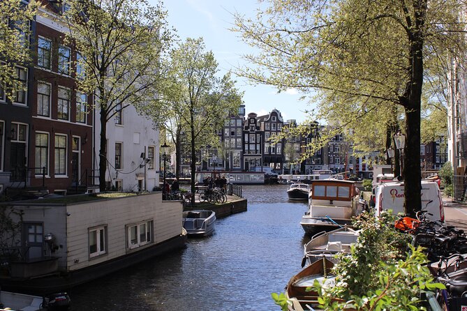 History & culture tour in Amsterdam with a local - House on the Three Canals, architecture that changes how you see bridges