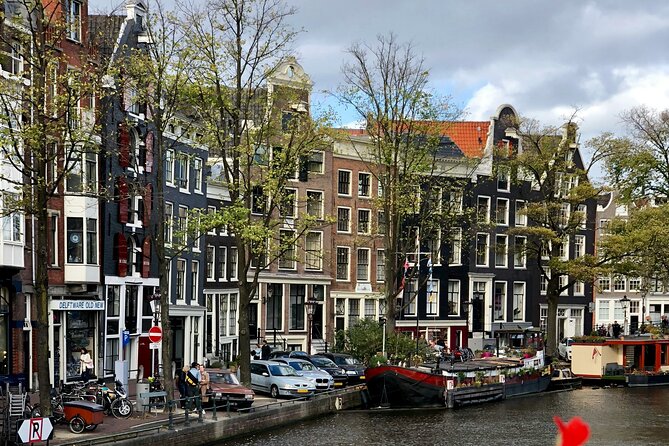 Personalized Hidden Gems of Amsterdam Private Tour with a Local - St. Nicholas Basilica, “dancing” houses, and the wooden-house survival story