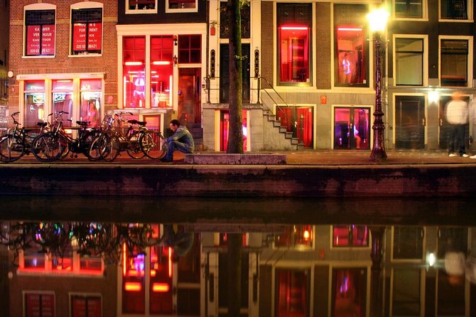 Private Amsterdam Red Light District and Coffee Shop Tour - Inside the Red Light District: Law, Tolerance, and Real Life