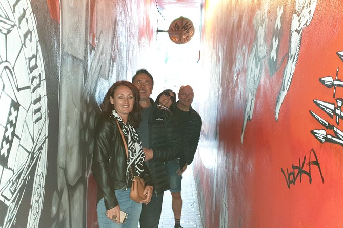 Private Amsterdam Red Light District and Coffee Shop Tour - Damrak Beginnings: City Built on Wooden Piles