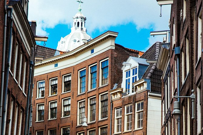 Private City Kickstart Tour: Amsterdam - St Nicholas Church, Chinatown Vibes, and the Red Light District Reality Check