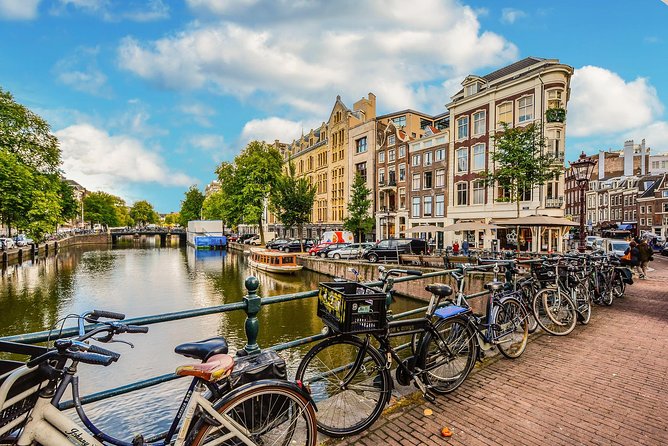 Private Tour: Amsterdam City Walking Tour and Canal Cruise - Dam Square to Royal Palace, the civic heart in plain language