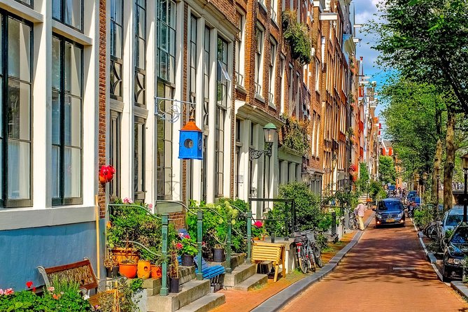 Private Tour: Amsterdam City Walking Tour and Canal Cruise - The canal cruise from water level, Golden Age sights and UNESCO context