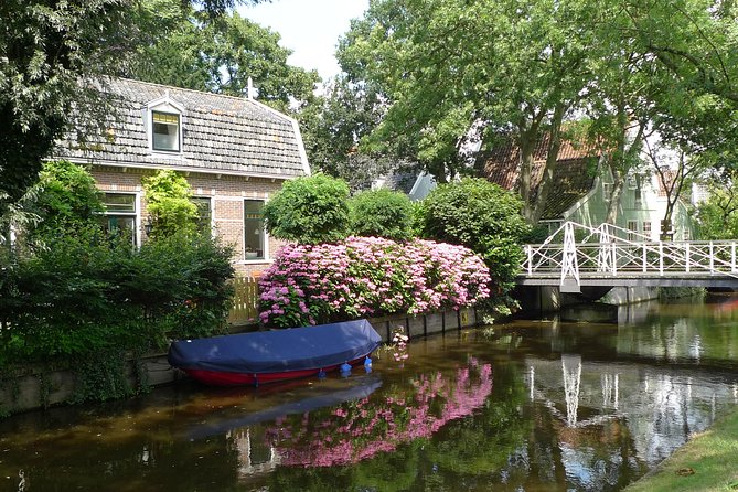 Private Tour Zaanse Schans Windmills and Volendam in Jaguar - Zaanse Schans Windmills: Cheese, Clogs, and Bridges in One Block of Time
