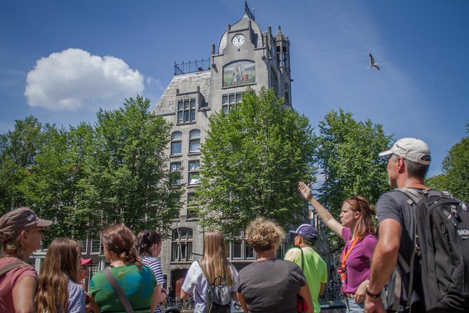 Secrets of Amsterdam Walking Tour plus Dutch Sweets Tasting - Dam Square start, Royal Palace and New Church to set the timeline