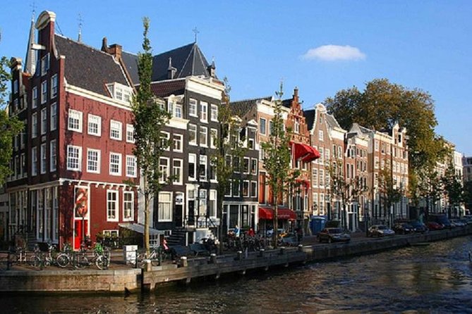Secrets of Amsterdam Walking Tour plus Dutch Sweets Tasting - Nieuwmarkt and De Waag, stand where art history meets the street