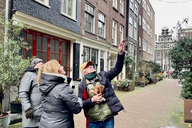 Small Group Walking Tour in Amsterdam with Friendly and Fun Guide - Begijnhof: the hofje courtyard that slows your day down