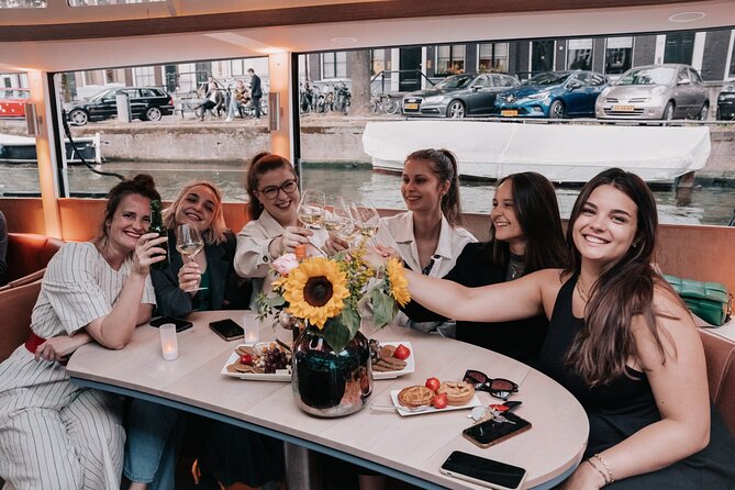The Ultimate Amsterdam Canal Cruise - 2hr - Small Group with Drinks & Snacks - Onboard comfort: snacks, bottled water, and the open bar pace