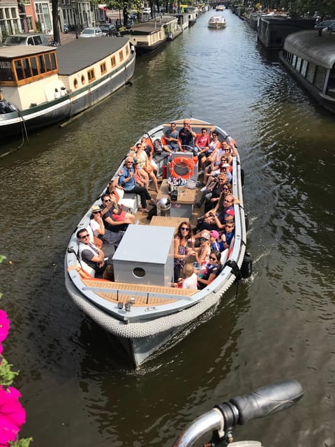 Visit Amsterdam by Boat with a French Guide (french) - Why the Small Electric Boat Matters for Canal Views