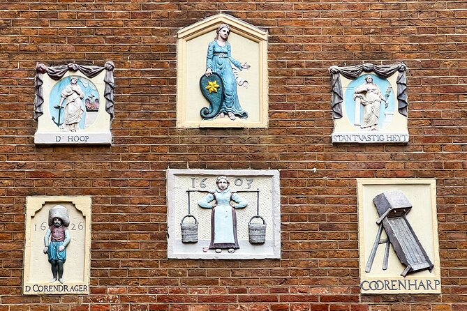 Walking Tour about Golden Age Architecture, private local guide - Jordaan gevelstenen: the little “story stones” in the facade