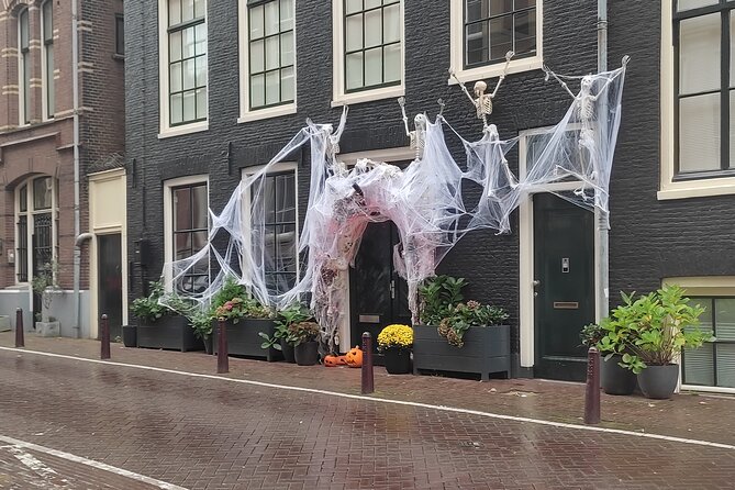 Walking Tour of Haunted Amsterdam - Dam Square costume welcome, then right into street-level lore