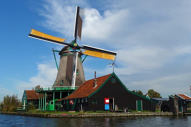 Zaanse Schans Windmills, cheese and clogs and Volendam tour from Amsterdam - Henri Willig Cheese Farm: Robot Milking, Cow Time, and Free Tastings