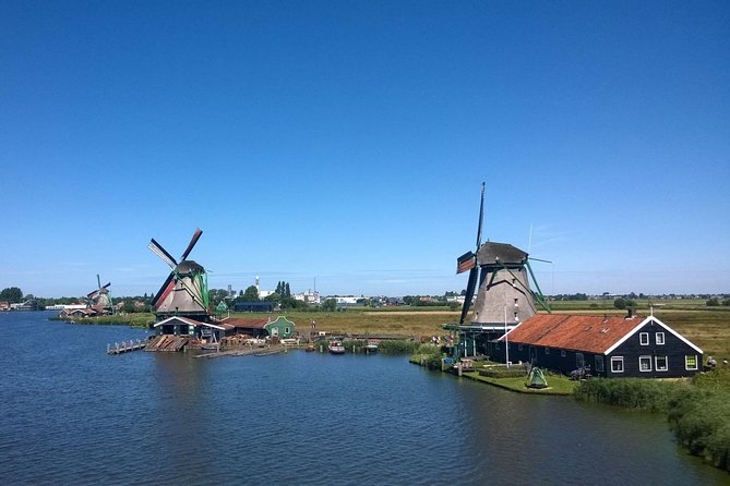 Zaanse Schans Windmills Private Tour from Amsterdam Airport - Kooijman Souvenirs & Clogs: Watch Clocks, Tools, and Hands at Work